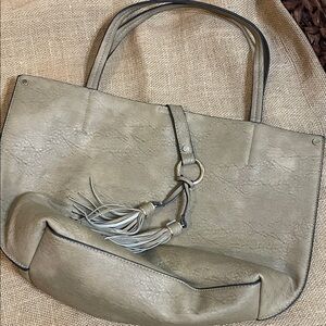 Elegant Tan Tote Bag with Tassel Accents